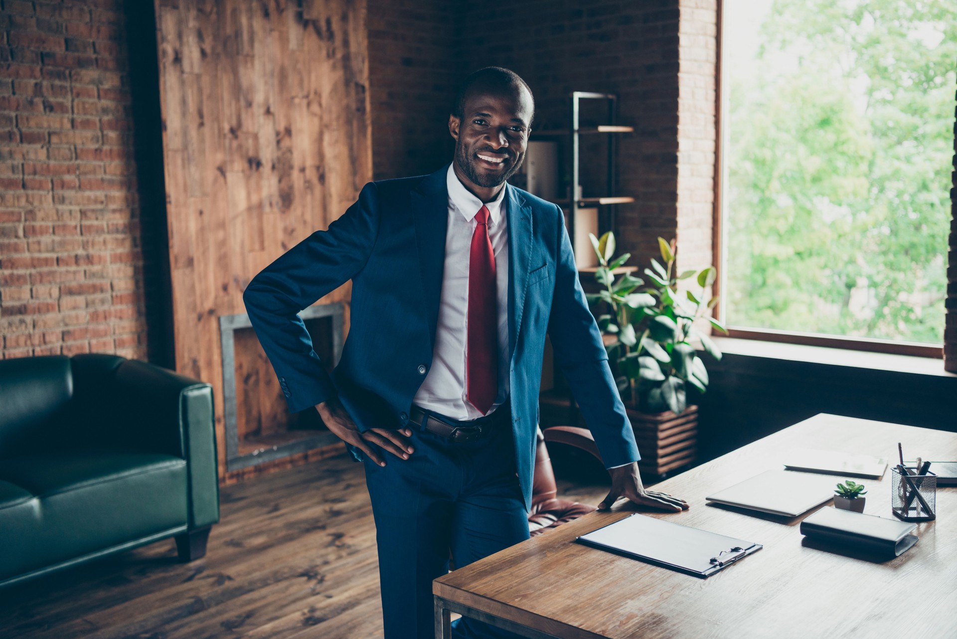Photo of dark skin guy best trader meet colleagues wear elegant costume standing near table